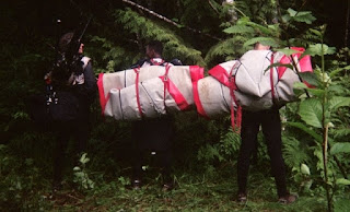 taking a nature break with boats strapped to our back