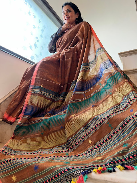 Our collection of cotton bhujodi saree with multicolor hand-done tassels