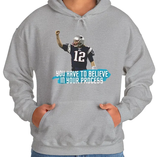A Hoodie With NFL Player Tom Brady Raising His Right Hand and Caption You Have to Believe