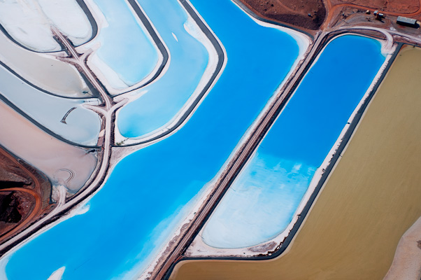 "Potash evaporation ponds with blue dye near Moab, Utah..." by Kevin Beebe - aerial desert photography