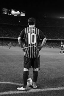 Lionel Messi back view in black shirt