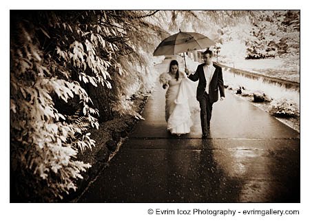 romantic couple kissing in rain. romantic couple kissing in