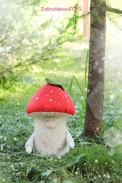 Christmas gnome with a red mushroom hat in the forest by sewing patterns of Zatinatskaya Natalia