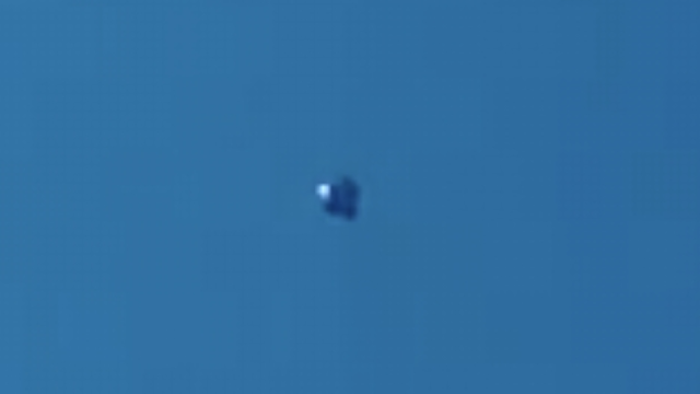 The light's are turning off and on with the silver metallic UFO sighting over Calgary, Alberta Canada.