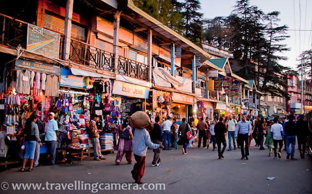 This PHOTO JOURNEY is about one of the wonderful walks around capital city of Himachal Pradesh, INDIA. Since Shimla is blessed with wonderful weather throughout the year, people love to walk from one place to other and now many tourists love to explore these walks and few of them avoid due to age issues. Above photograph shows Sanjauli from the road which connects Sanjauli Market with Mall Road through IGMC and Lakkar Mazar...The first thing which comes on the way to Mall Road from Sanjauli Market. Sanjauli College 'Rajkiya Mahavidyalaya, Sanjauli' ... It's one of the popular educational institution in Shimla !!!This is new building on Government College Sanjauli... Somehow all the buildings in Shimla are beautiful and each one sets new standards in terms of architecture ...This is huge complex of biggest Medical College of Himachal Pradesh. Indira Gandhi Medical College, Shimla.Main building on Indira Gandhi Medical College (IGMC), Shimla !!! This whole campus has one hospital and a Medical college. This is one of the most advanced hospital  in Himachal Pradesh, INDIA. Place is also known as snowdown.This is one of the popular walks around Mall Road. Few years back, cycles were also available on rent for this route form Sanjauli to Mall Road !!! This is approximately 3 kilometers walk through some of the beautiful spots on the way...It's impossible to reach Mall Road, without meeting monkeys on the way and we were lucky to have a silent meeting :) ... This family was happily sitting on roof-top !!!It was evening time and after crossing IGMC, we got to see the hues of sunset in Shimla. Have you see clear sun like this? It's easy to find full moon like this but brightness around the sun always hide the actual shape.After few miles of walk on relatively calm roads, we hit Lakkar Bazar. Lakkar Bazar is one of the main markets in Shimla and popular among tourists. There are lot of shops offering wooden materials for home and offices.Since none of us was interested in shopping, we moved towards Ridge with wonderful lighting around Christ Church... Sky was clear on that day and it was blue hour...After having some tea and snacks, we moved towards Mall Road. The building in above photograph is Gaiety Theatre building on Mall Road. This building is renovated last year only.For a change we also visited Lower Bazar, which is relatively cheap and a decent place to buy woolens. This market has various sections - cloth market, spice market, meat market etc...This walk ended in Lower Bazar of Shimla, but most of the folks from Sanjauli love to take this walk for mall road. The other way to reach Mall road is via bus, which is longer route of 8 kilometers. After that one needs ot climb up till Mall Road or take Lift. 