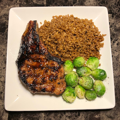 Maple grilled Berkshire pork rib chop, steamed Brussels sprouts and farro