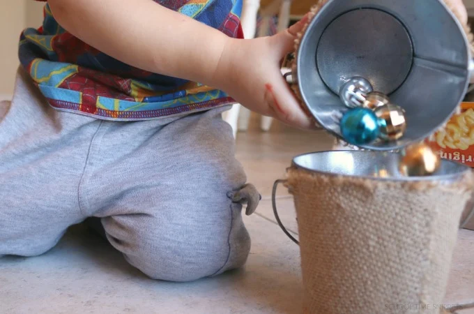 pouring christmas bulbs for fine motor skills development