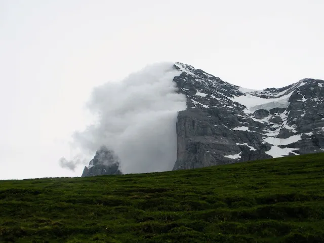 The Eiger with clouds streaming out of it in Switzerland