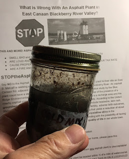 Cold Patch Asphalt coating inside a jar.