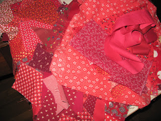 a pile of red fabric scraps