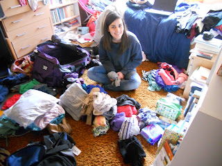 Me nearly buried under my clothing... no, i did not take all of that-- and no, you can't see about half the clothes I have on the floor!