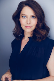 Photo of woman looking at camera.