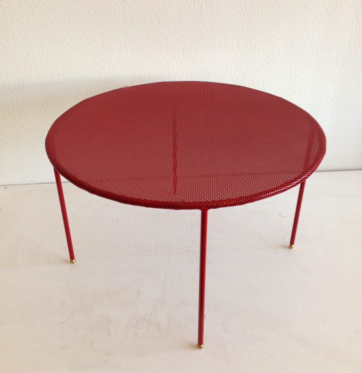 Blood red perforated steel coffee tables