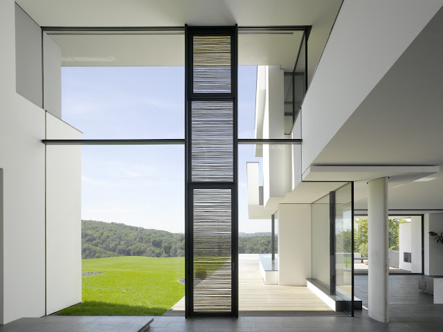Photo of glass wall of an amazing home as seen from the interior