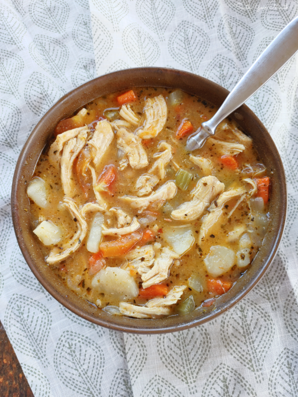 Tuscan Chicken Stew! A hearty, rustic chicken stew recipe made with chicken, potatoes, white beans, fresh tomatoes and tons of country-Italian flavor.
