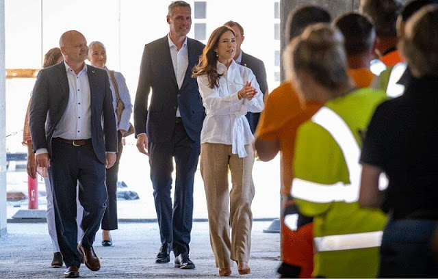 Crown Princess Mary wore a white belted linen shirt by Ralph Lauren. Polo Ralph Lauren mid-rise straight leg trousers