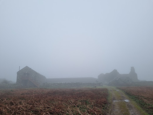 The Farm is hard to see in the fog.