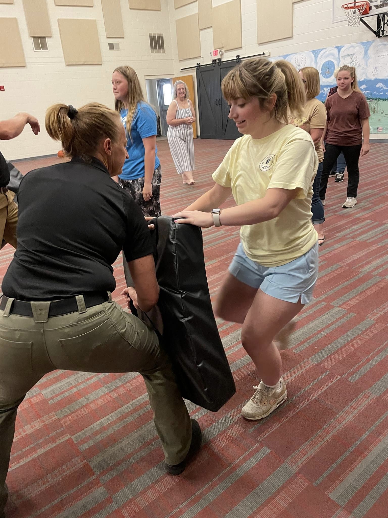 Empowering women's self-defense workshop in action.