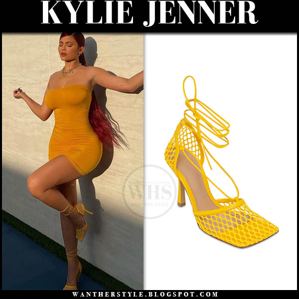 Kylie Jenner in orange tube dress and yellow pumps