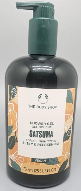 The Body Shop Satsuma Shower Gel dark green pump dispenser, bottle, and font with blue leaves and orange oranges on label.