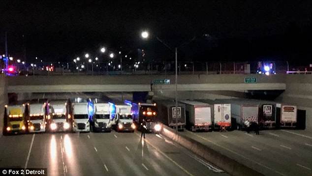 Police Trucks Parked Under A Bridge To Prevent A Man From Committing Suicide