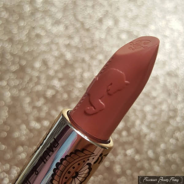 close up of carousel horse head embossed on lipstick surface