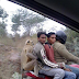 Four People Sitting on The Motorcycle