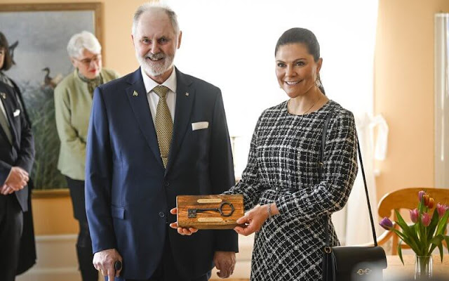 Crown Princess Victoria wore a maygen top, and a schain skirt by Baum und Pferdgarten, and a beige Robe belted wool coat by Toteme