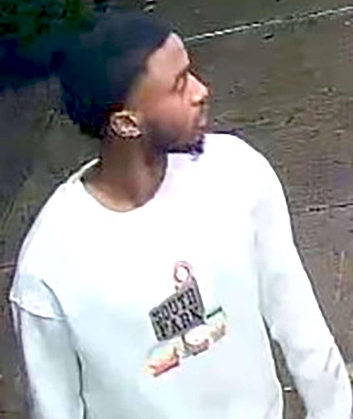 The NYPD is searching for a man dressed in a "South Park" sweatshirt in connection with a shooting inside a Queens restaurant.