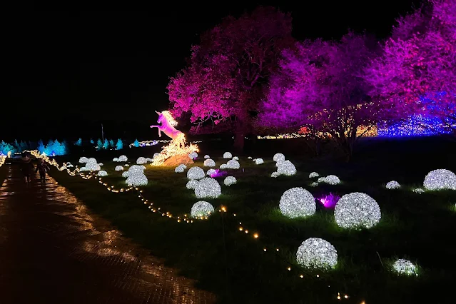 The Winter unicorn display with alit up mane and tail and white balls of light on the ground around it