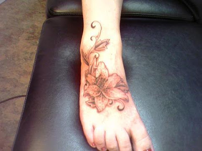 Large flower foot tattoo artwork.