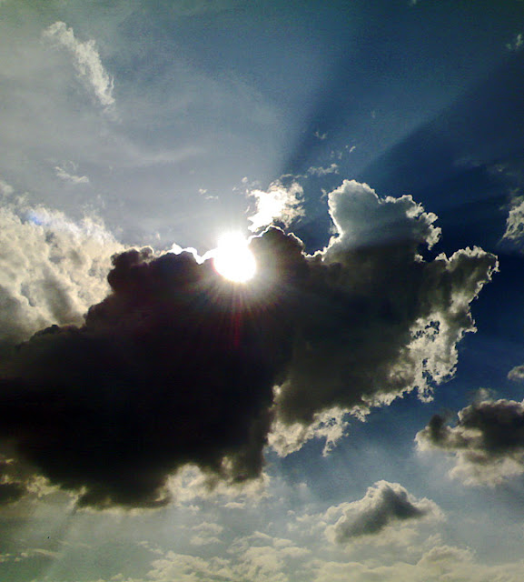 dark clouds with sun peeping out