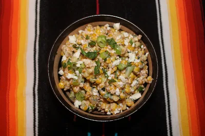 Bowl of warm Mexican corn salad.