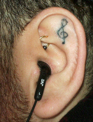 He had this musical symbol the treble or G Clef tattooed in his left ear