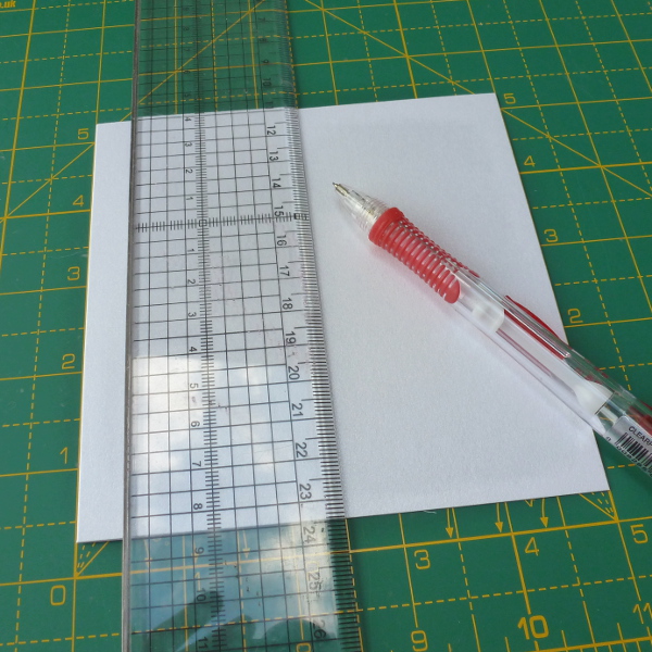 Measuring halfway up the card blank front to make a basic easel card