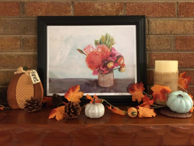 I enjoy mixing neutral shades with the traditional orange and yellows of fall to create a rustic fall mantel and wooden toolbox centerpiece.