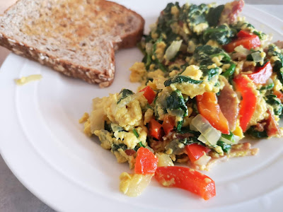 Scrambled eggs with spinach, red pepper, onions and bacon