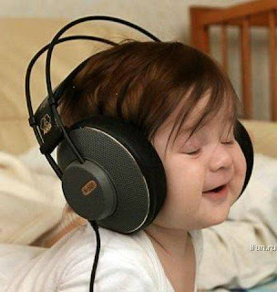 Cute Baby Pictures Enjoying Music in Wallpaper