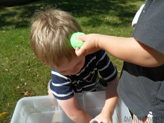 Toddler retelling The Gruffalo by placing a poisonous wart