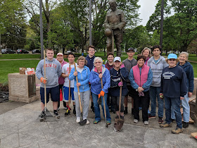 a hearty bunch of Garden Club members, boys scouts and high schoolers were working on the flower beds at the Town Common and willingly posed for the photo