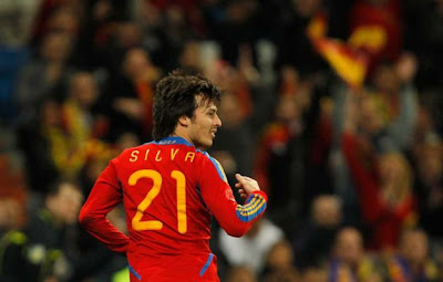 Spain's David Silva celebrates after scoring against Colombia during an international friendly soccer match at the Santiago Bernabeu stadium in Madrid on Wednesday, Feb. 9, 2011. Photo