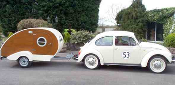 VW Beetle in Herbie film style towing a Teardrop caravan