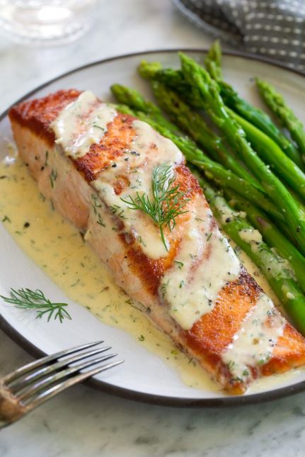 Salmon with Creamy Garlic Dijon Sauce is such a flavorful, elegant dish that anyone can pull off. It’s comes together so quickly yet it’s sure to impress anyone. Pan seared salmon is perfectly delicious on it’s own but when you add a bright sauce like this it takes it to a whole new level!