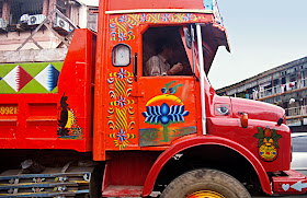 brightly painted truck with religous motifs