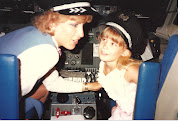 my mom, a former flight attendant, and me. manning the cockpit.