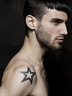 This man's shoulder star tattoo matches the look on his face fierce
