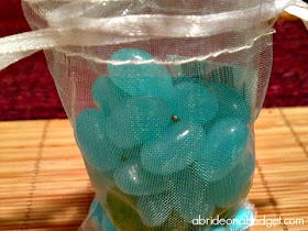 Edible favors are a big hit at weddings. You'll love this DIY Ombre Candy Bag Favor from www.abrideonabudget.com. It's super easy to make and your guests will love it!