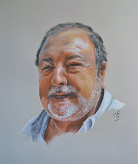 Retrato a pastel de un hombre con barba