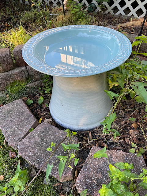 a blue birdbath