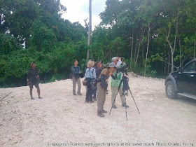 Singaporean tourists at Warduwer beach of Raja Ampat